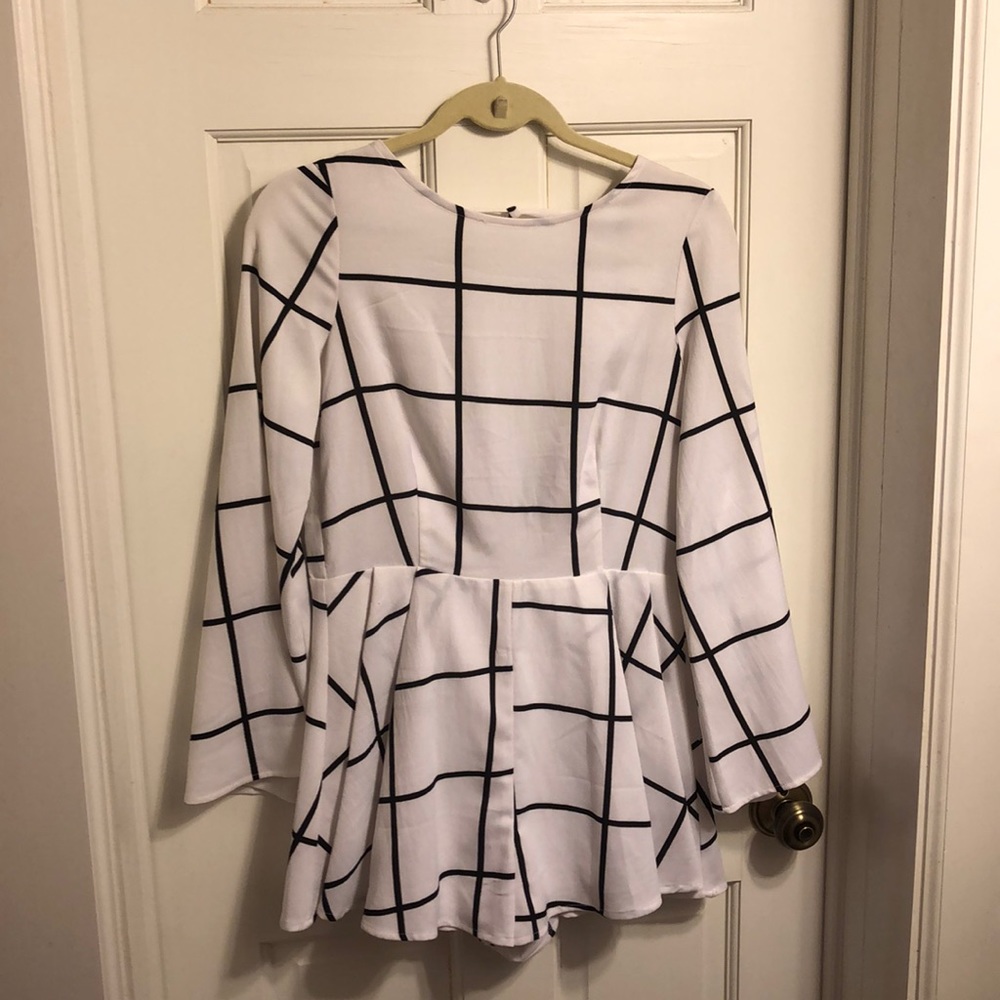 Akira black and white romper with bell sleeves.